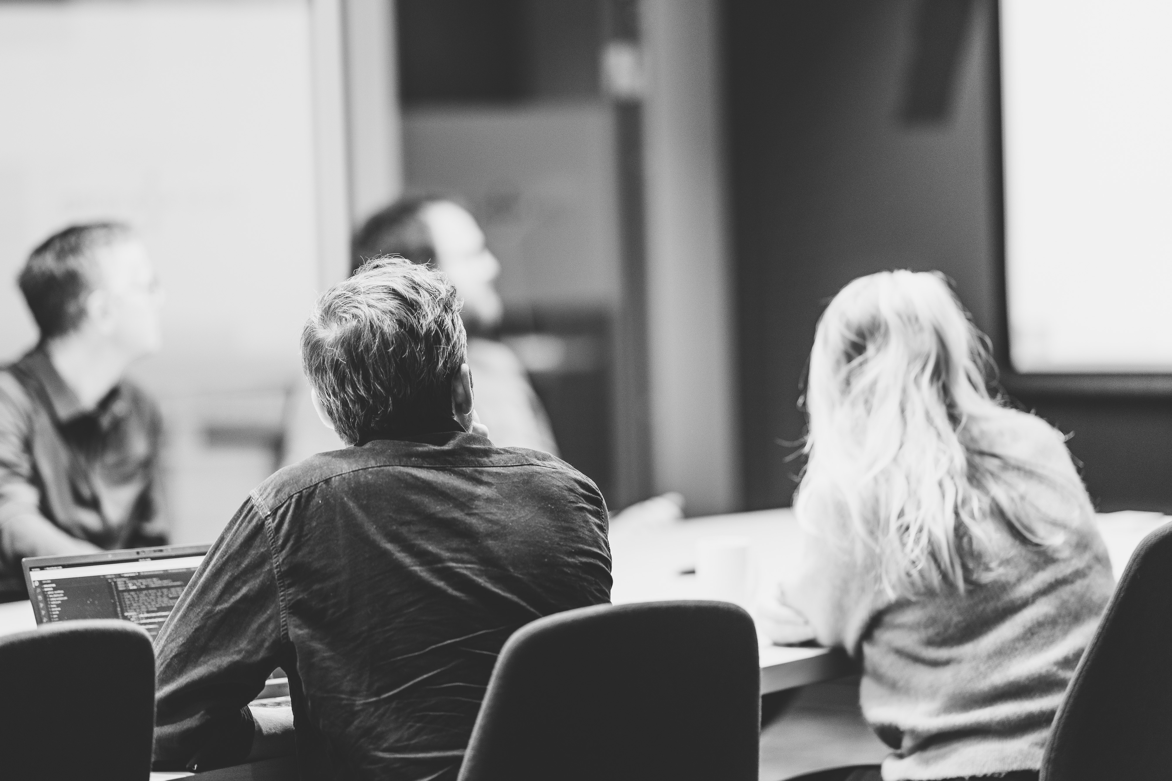 A group of people sitting in a room