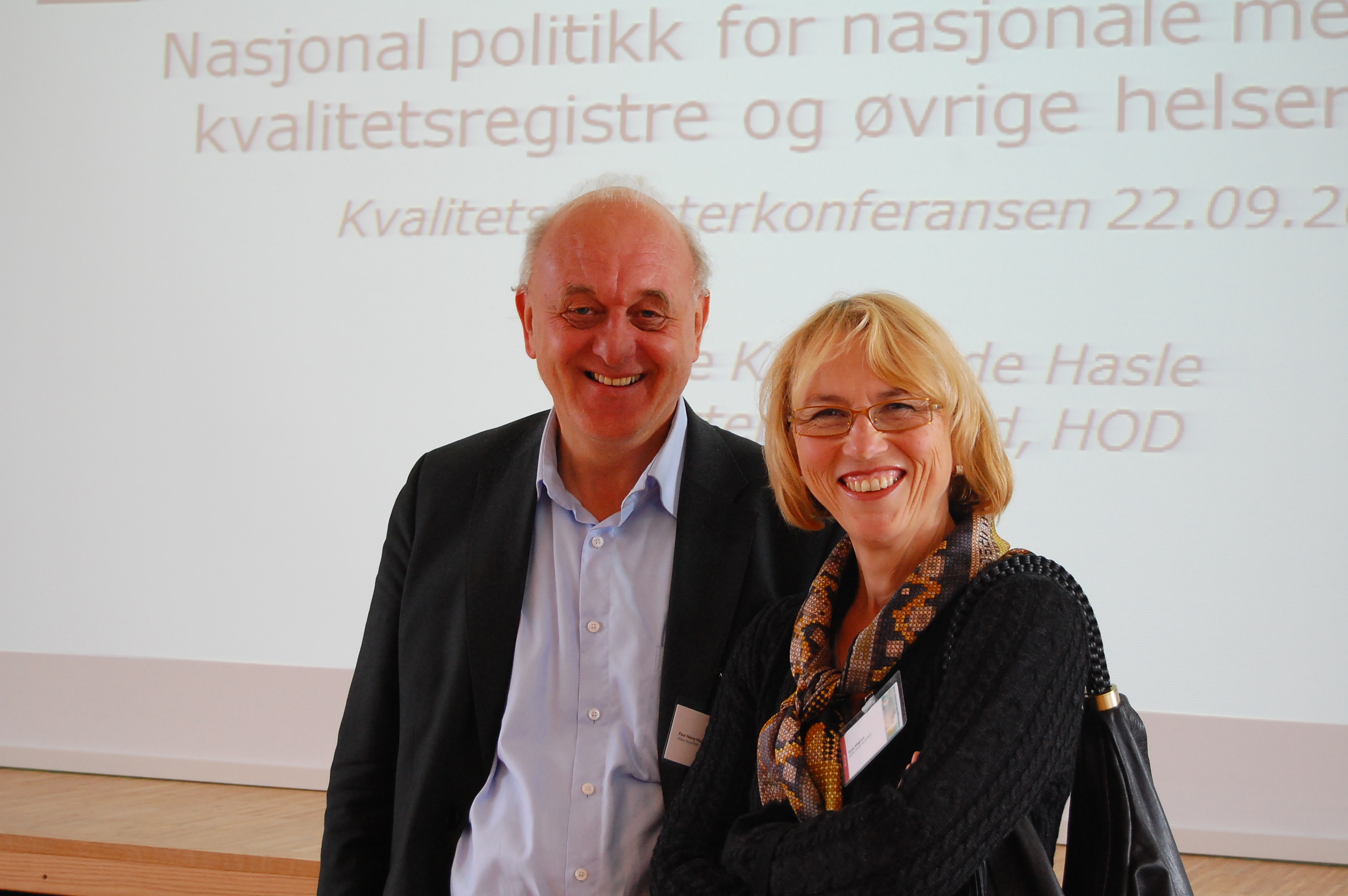 A man and woman smiling