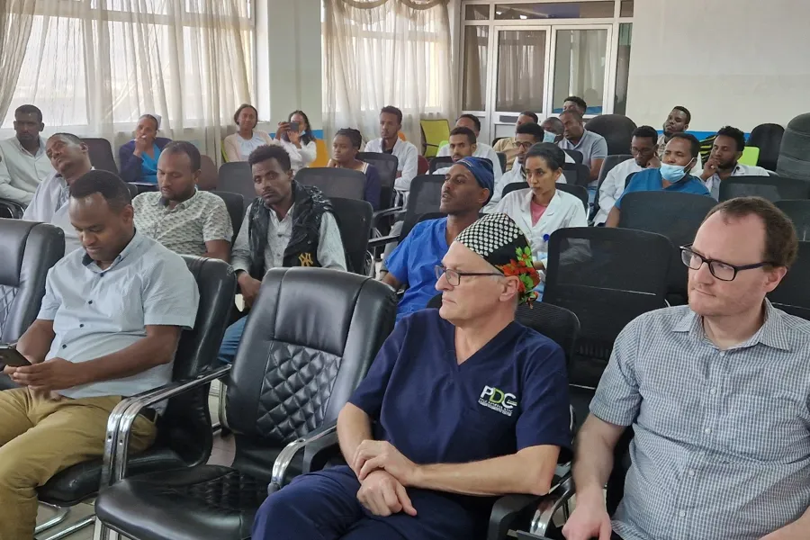 A group of people sitting in chairs