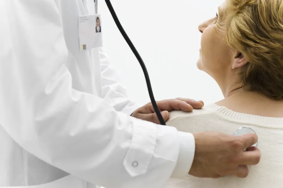 A doctor examining a patient