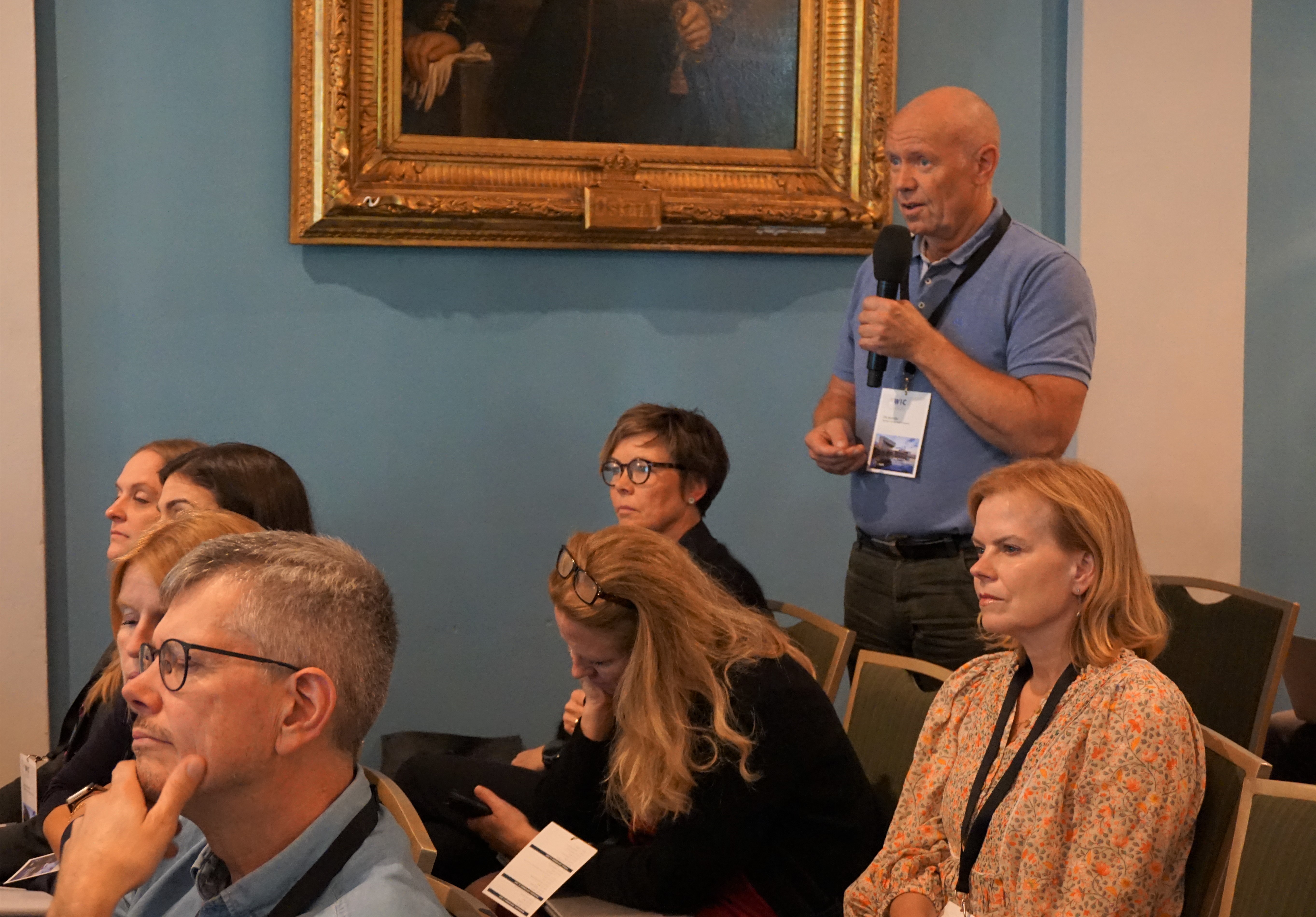A man speaking to a group of people