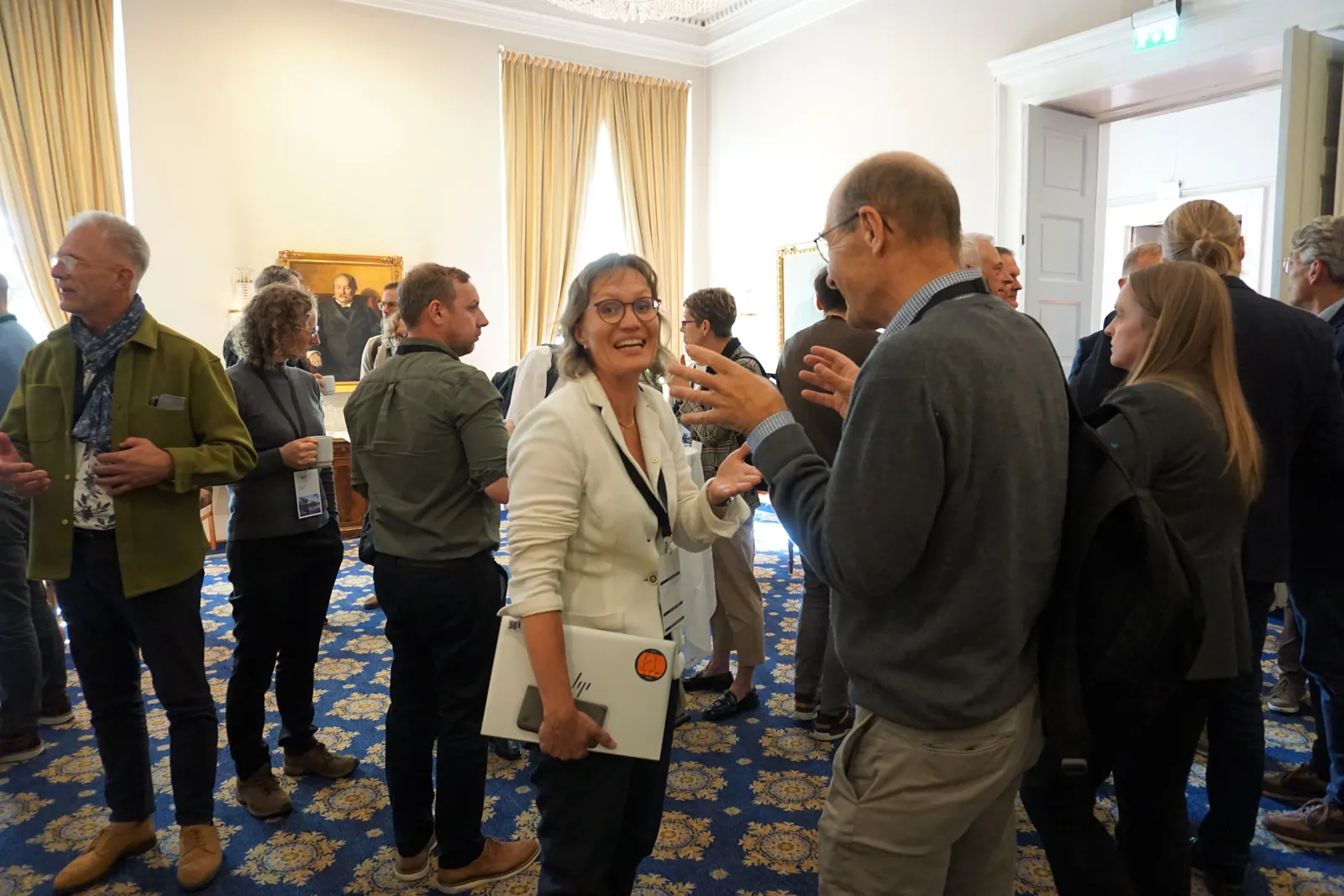 A group of people standing in a room