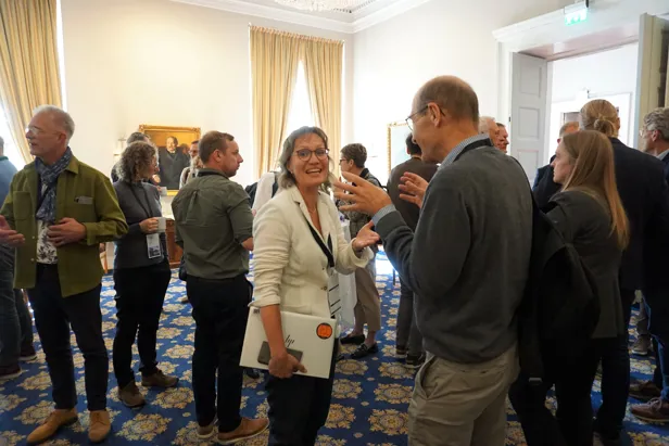 A group of people standing in a room