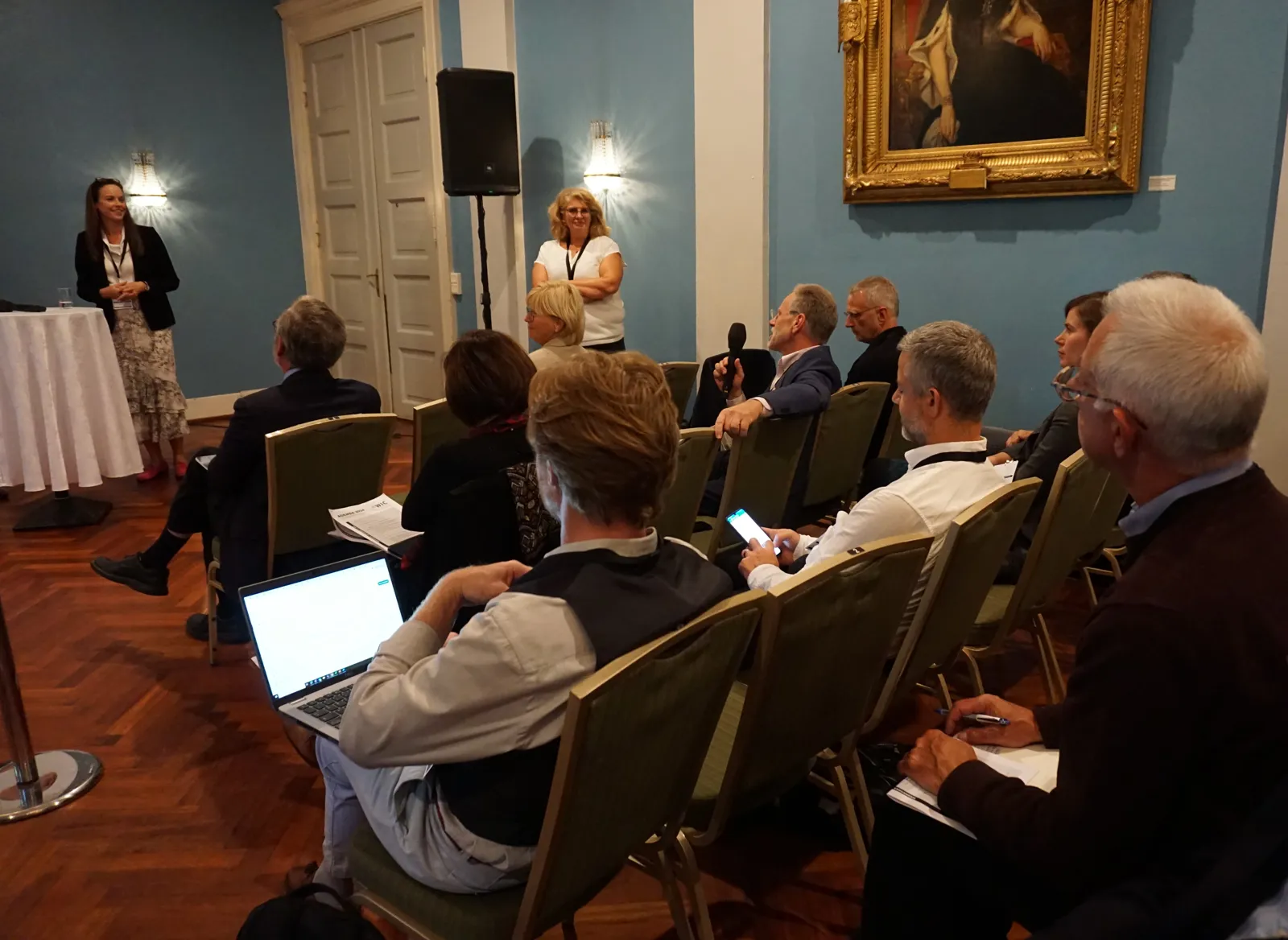 A group of people sitting in a room