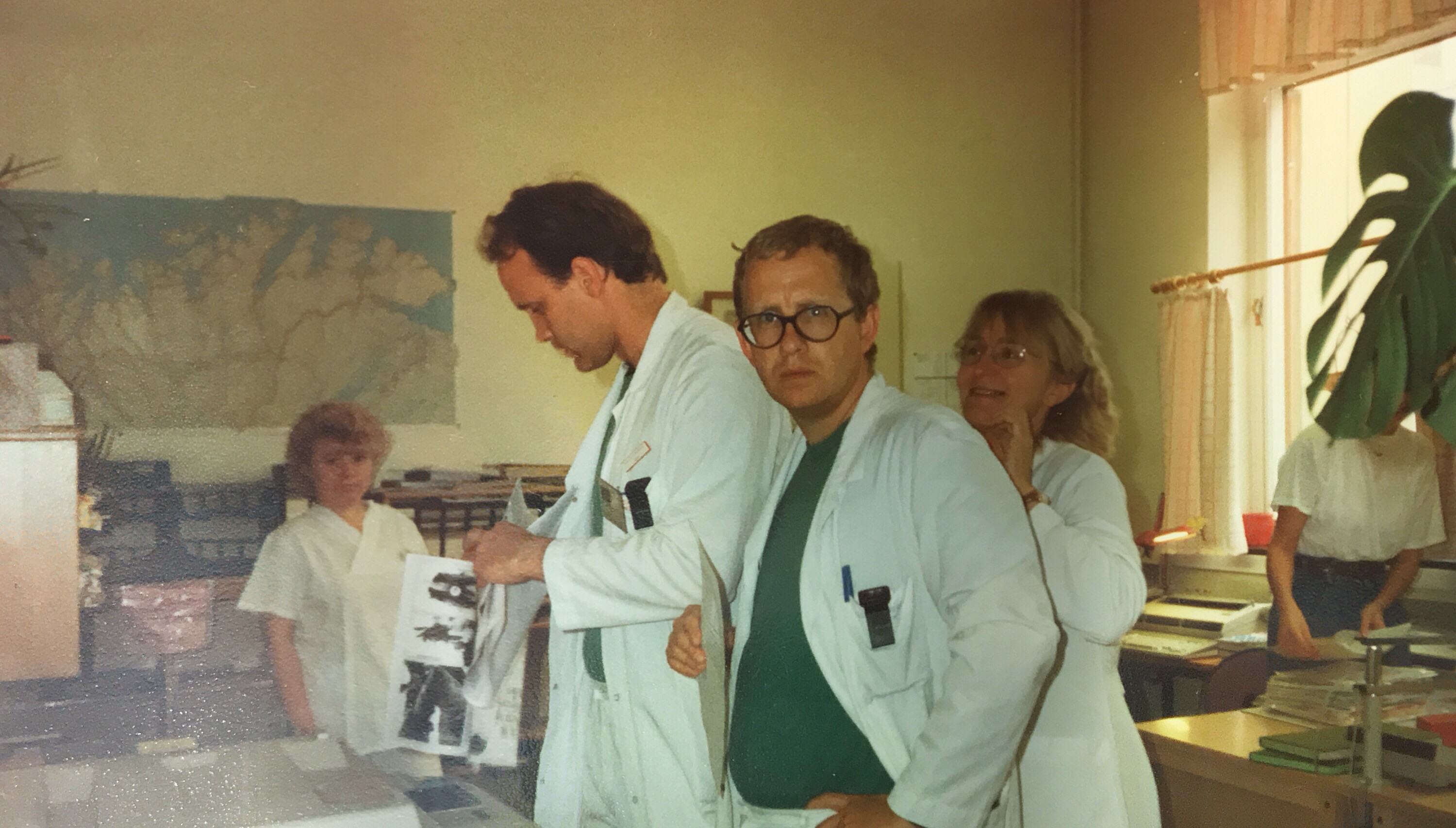 A group of people looking at a piece of paper