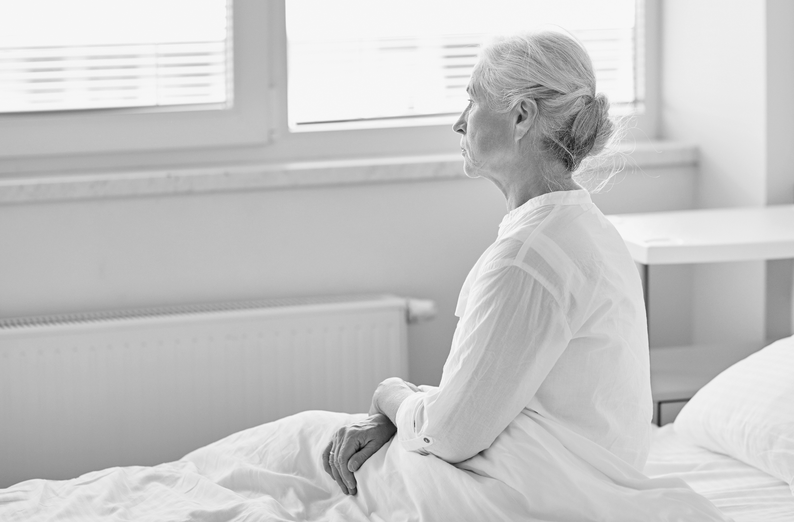 A person sitting on a bed