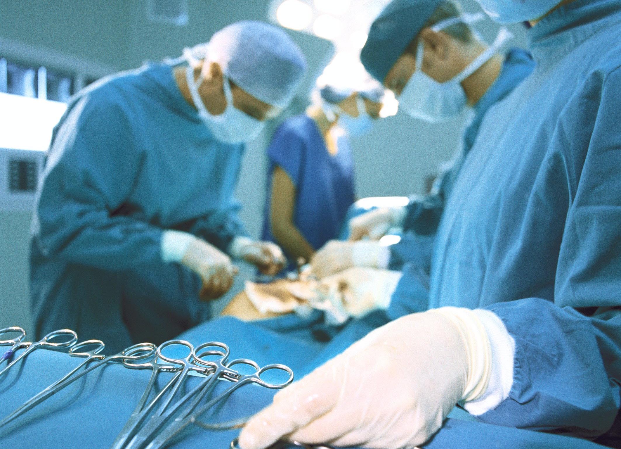 A group of surgeons performing surgery