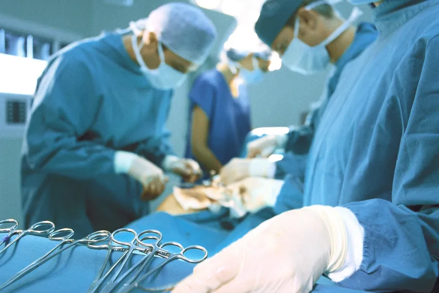A group of surgeons performing surgery