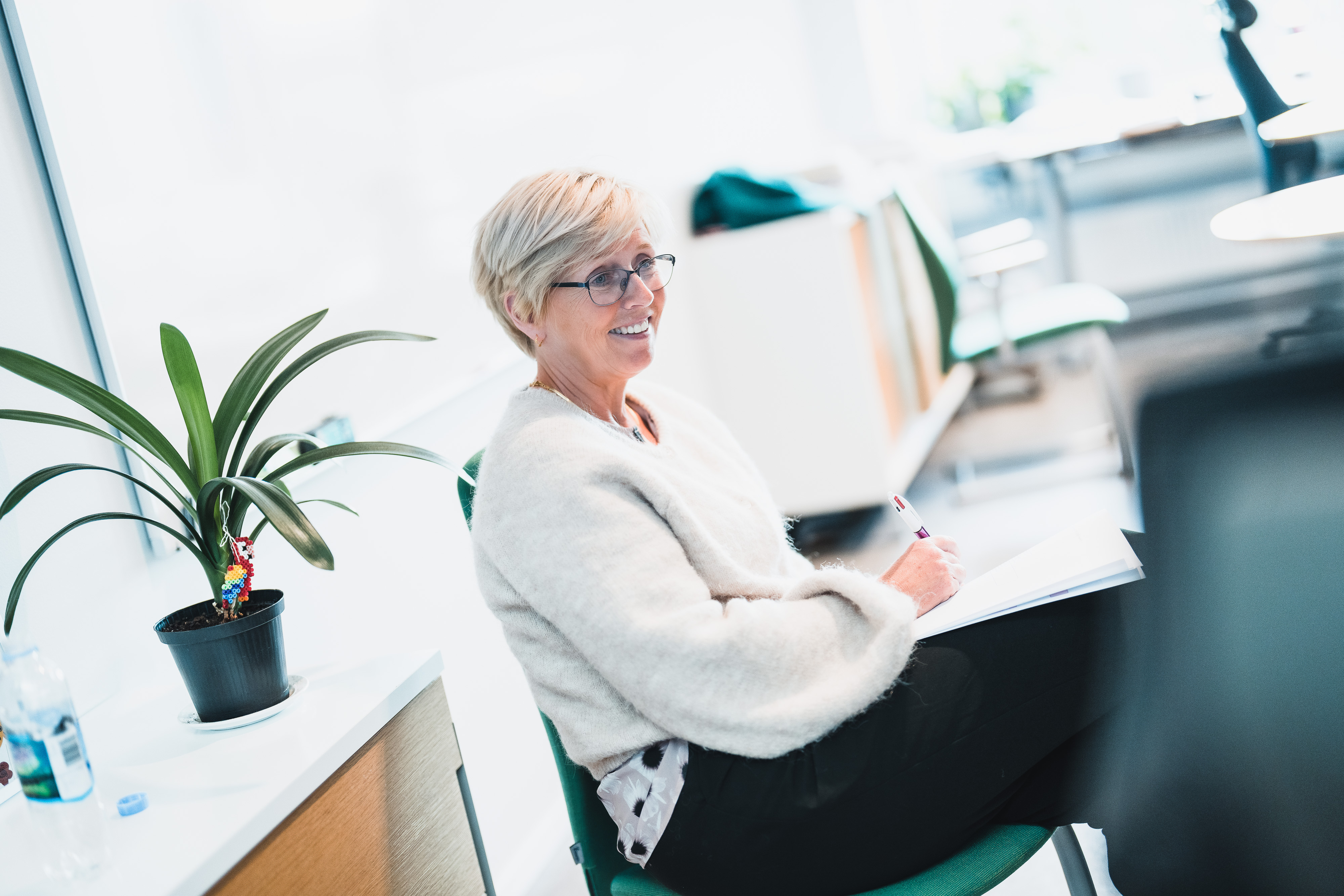 Eva Stensland sitting at a desk