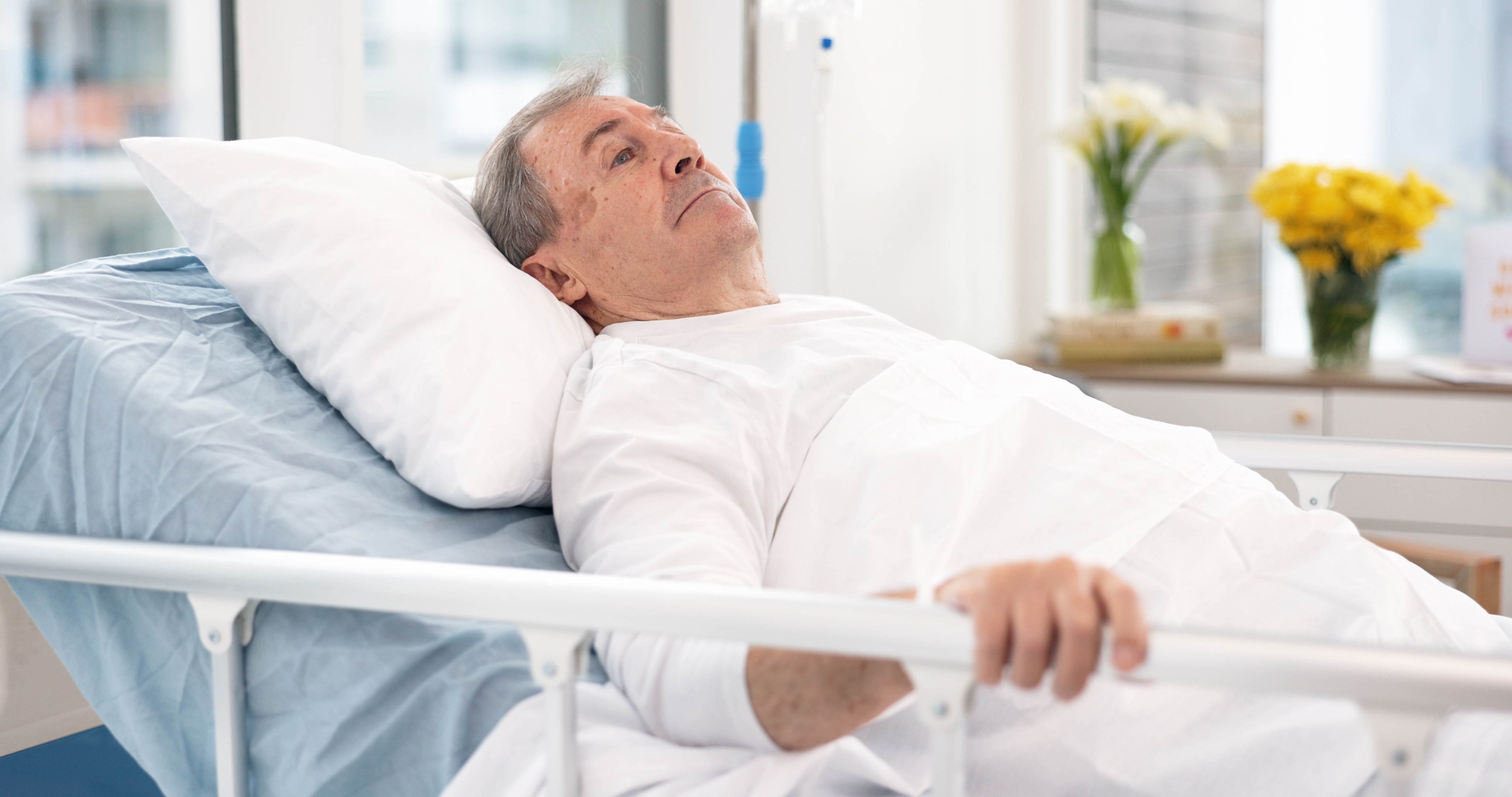 A man in a hospital bed