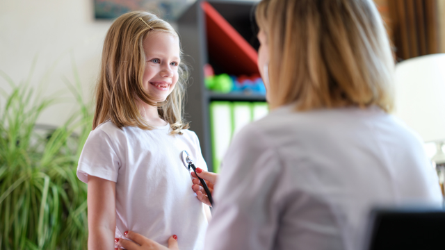Girl examined by doctor
